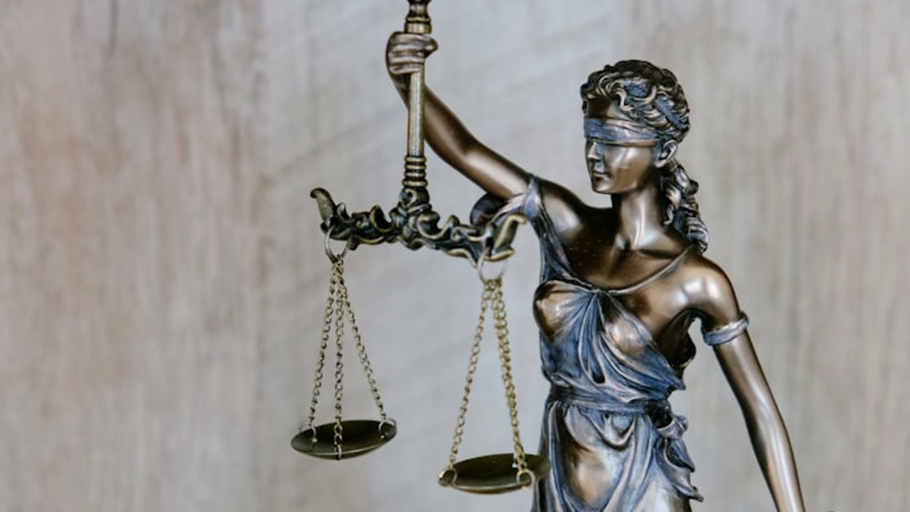 Courtroom scales of justice, gavel and law books